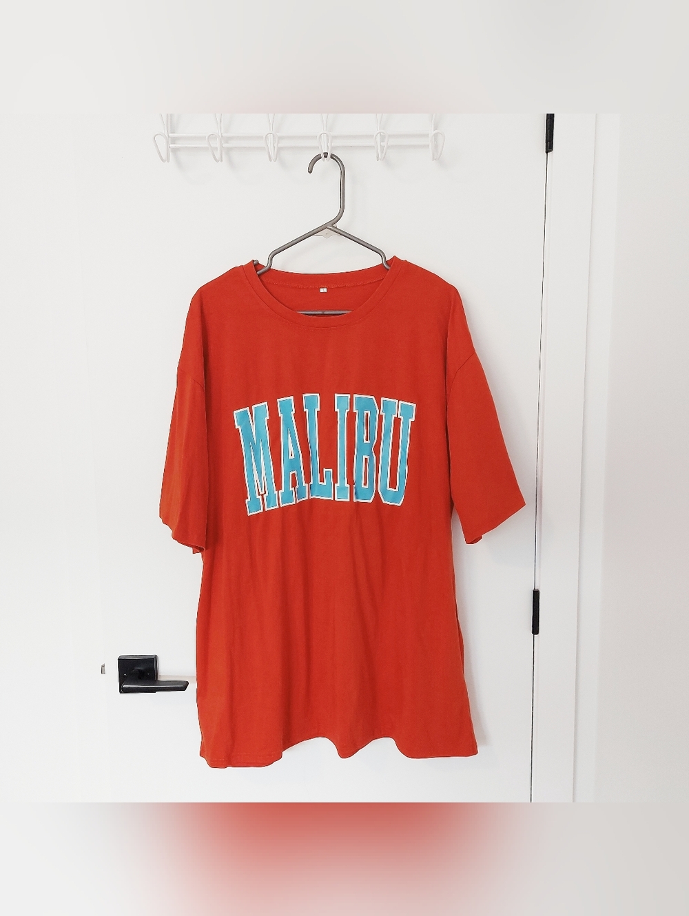 Bright orange oversized graphic t-shirt